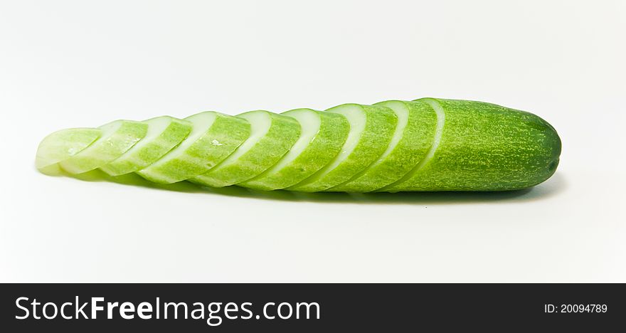 Cucumber and slices isolated on white background. Cucumber and slices isolated on white background.