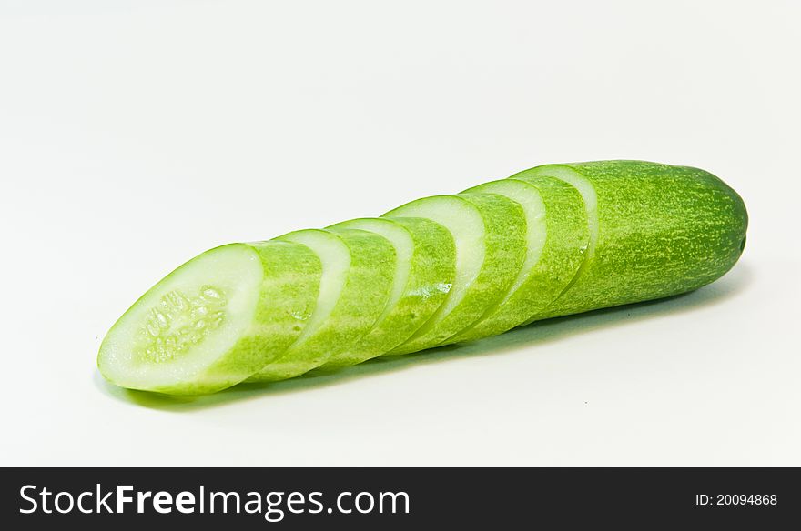 Cucumber and slices isolated on white background. Cucumber and slices isolated on white background.