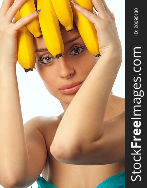 Shot of pretty girl with bananas over head. Food concept, healthcare. Shot of pretty girl with bananas over head. Food concept, healthcare.