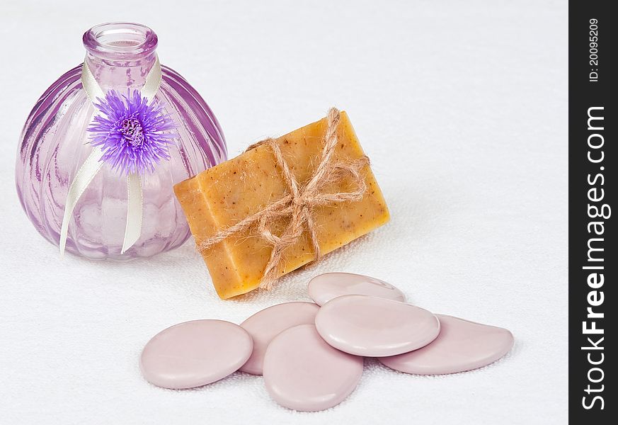 Bar of herbal soap with stones and a vase. Bar of herbal soap with stones and a vase