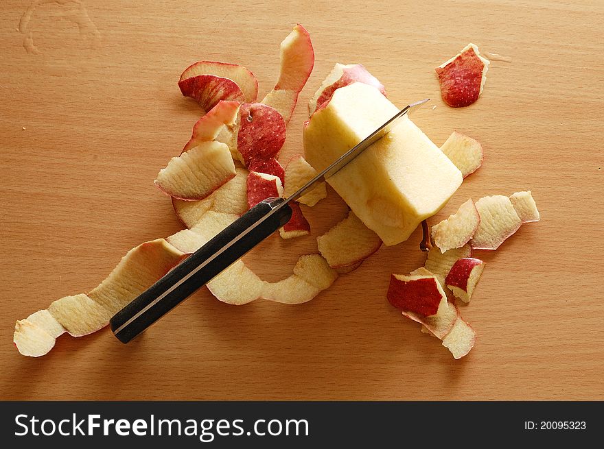 Slices of apple with black knife