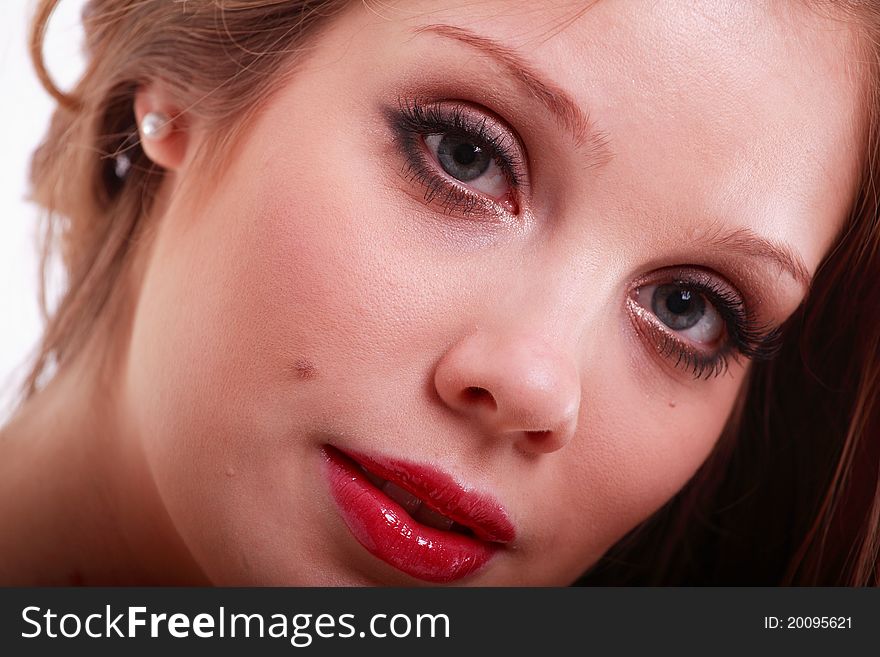 A close-up of a beautiful woman with red lipstick. A close-up of a beautiful woman with red lipstick