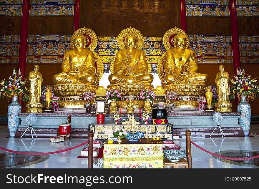 Three Chinese Buddha statues in temple