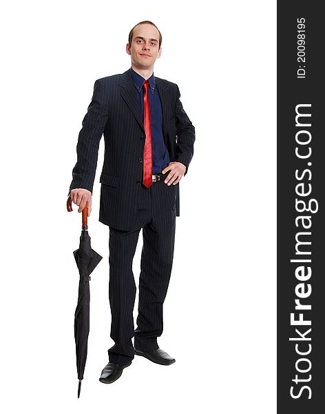 Image of successful businessman in elegant suit with folded umbrella