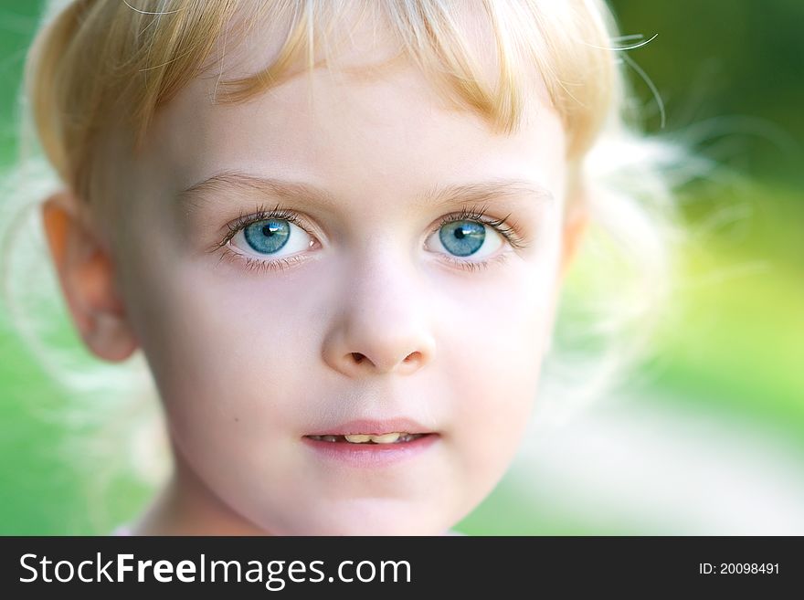 The little girl looked at us big blue eyes and smiles. The little girl looked at us big blue eyes and smiles