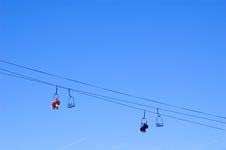 Skiers And Snowboarders In A Chairlift Stock Photo