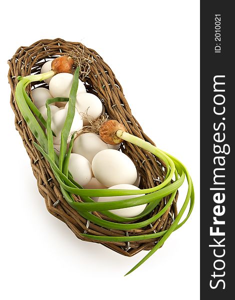 Basket with an onions and eggs-components of a healthy feed