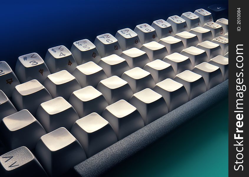 Closeup section of keyboard with blue and cyan gradients top and bottom. Closeup section of keyboard with blue and cyan gradients top and bottom