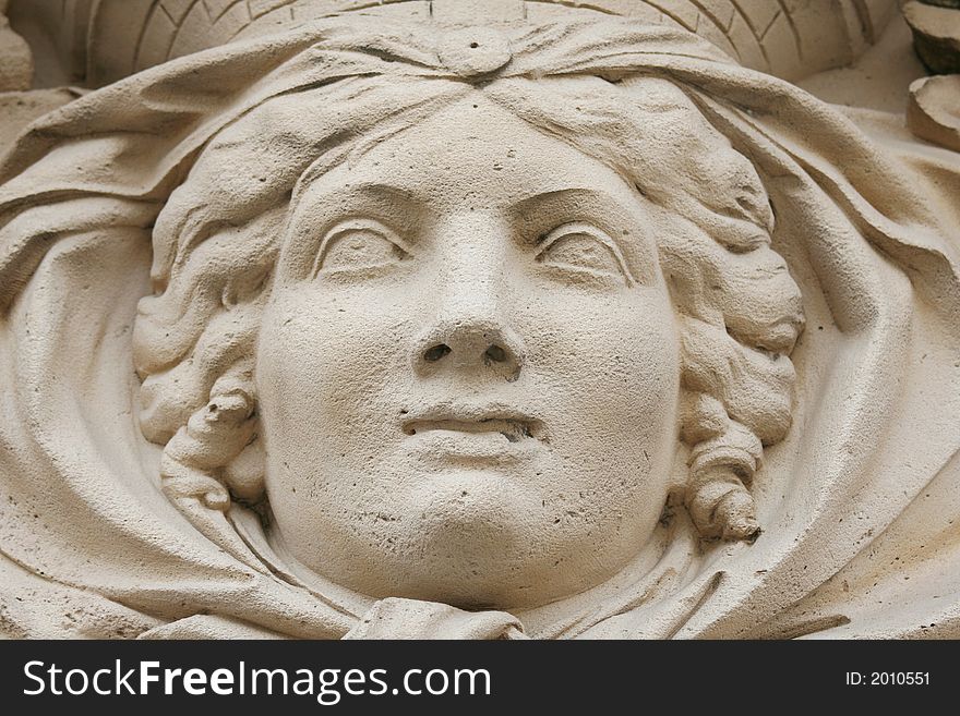 Antique stone statue woman face close-up. Antique stone statue woman face close-up