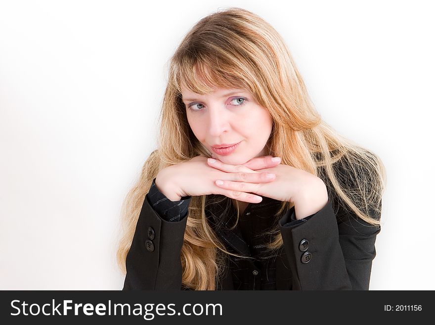 A blond woman resting her chin on her hands against a white background