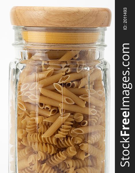 Top half of a jar of uncooked pasta with lid. Top half of a jar of uncooked pasta with lid