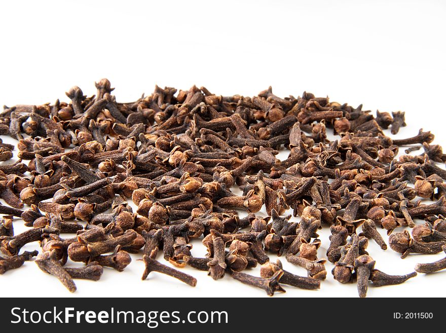 Whole cloves spices on white background