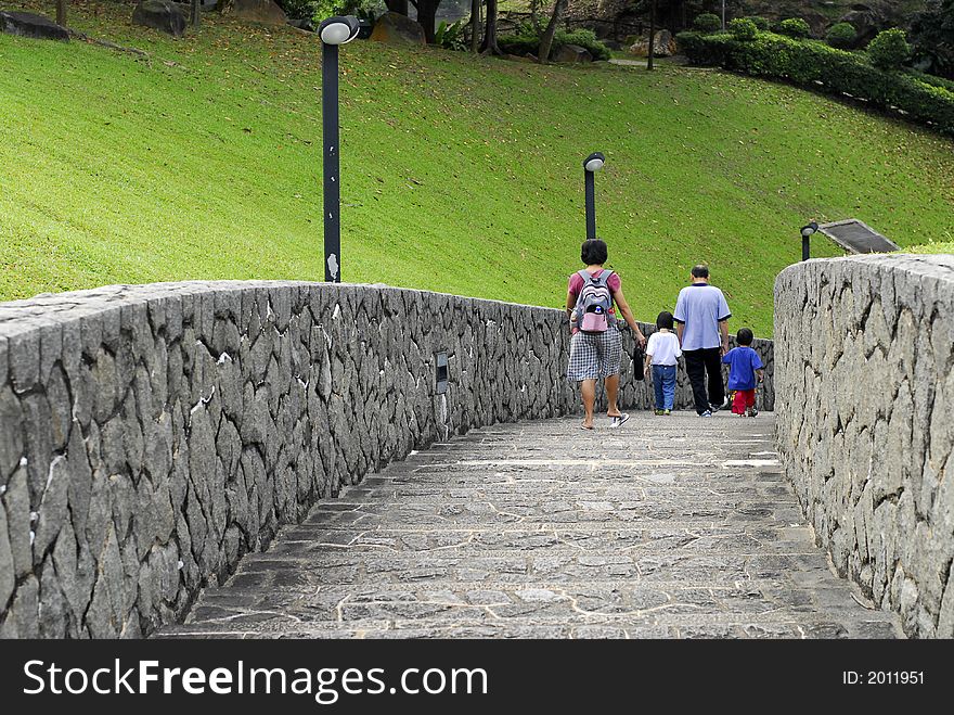 People walking down the stone road. People walking down the stone road