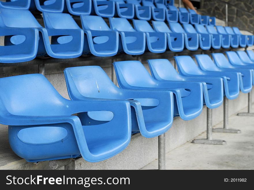 Rows of blue seats in the stadium