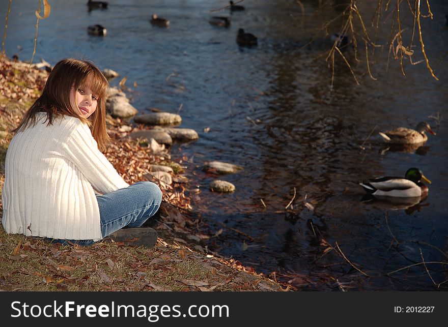 A girl in white at the lake