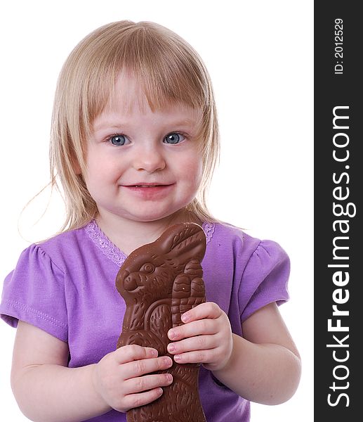 Toddler holding a chocolate rabbit. Toddler holding a chocolate rabbit