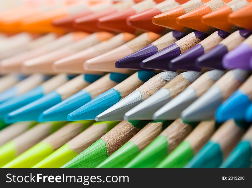 Abstract shot of stacked colored pencils. Shallow depth of field. Abstract shot of stacked colored pencils. Shallow depth of field.