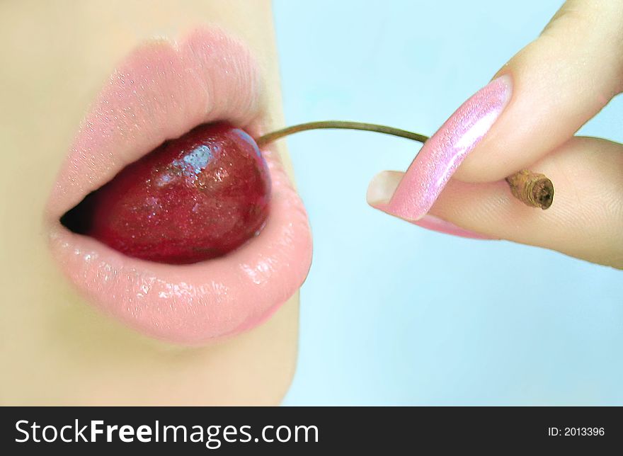 rose lips with cherry in teeth