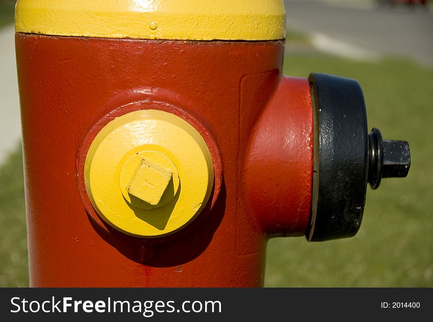 Red and yellow hydrant on a suburban street
