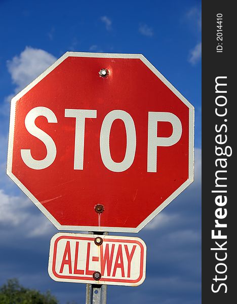 Street Stop Sign against a blue sky