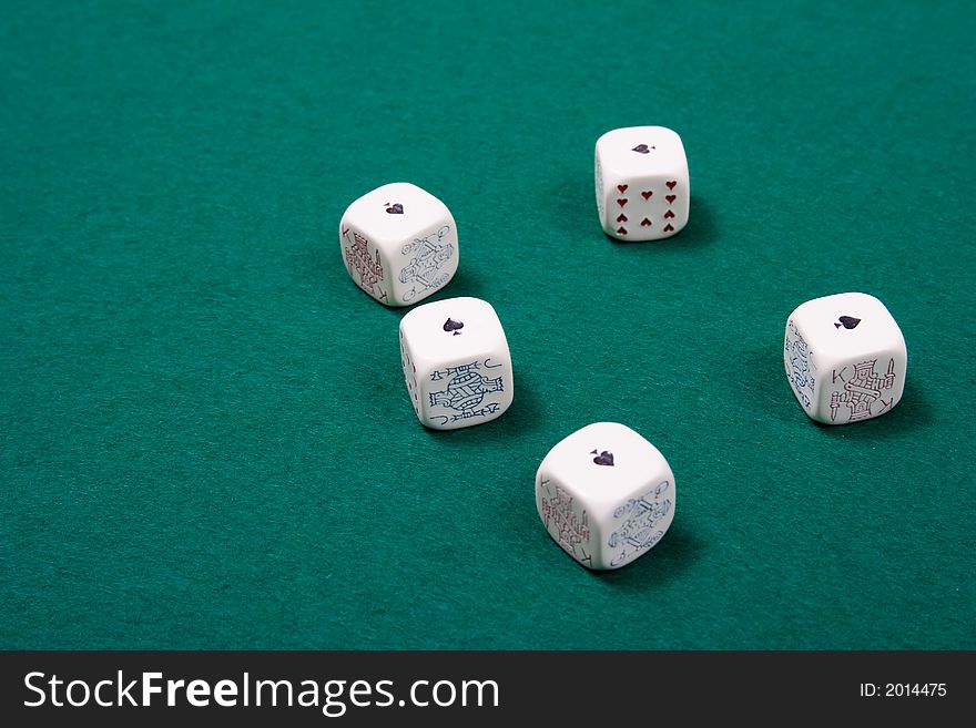 Poker dices at a poker game table. Shallow depth of field. Poker dices at a poker game table. Shallow depth of field