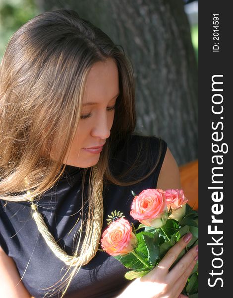 Girl with roses in park