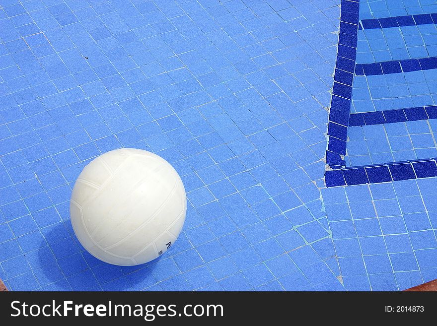 Volley ball in a swimming pool with blue mosaics. Volley ball in a swimming pool with blue mosaics