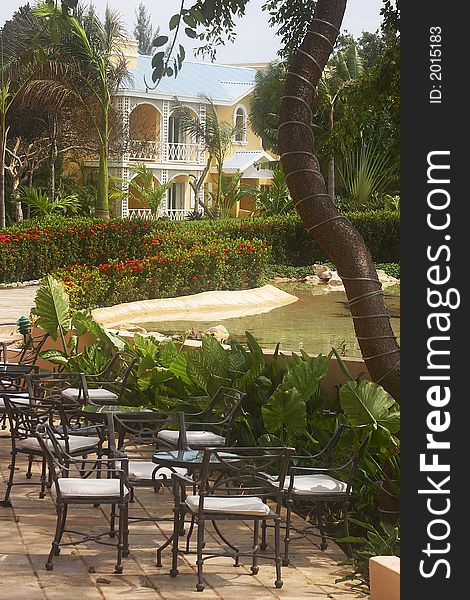 Garden with chairs of a hotel with hacienda like details in Cancun, Riviera Maya, Quinatan Roo, Mexico, Latin America