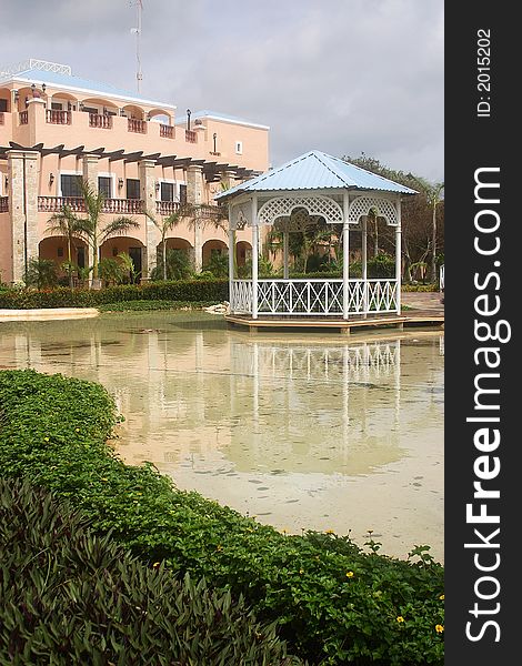 Artificial lake in  a hotel with hacienda like details in Cancun, Riviera Maya, Quinatan Roo, Mexico, Latin America. Artificial lake in  a hotel with hacienda like details in Cancun, Riviera Maya, Quinatan Roo, Mexico, Latin America