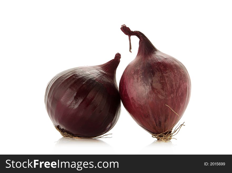 Red onions over white background