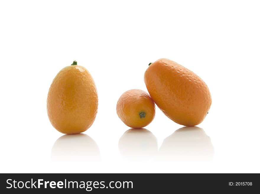 isolated kumquats over white background