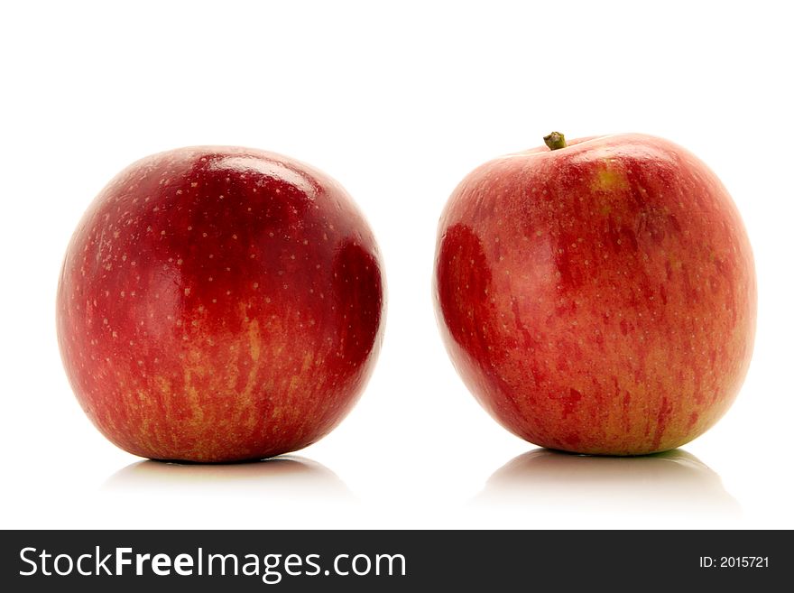 Red apples over white background