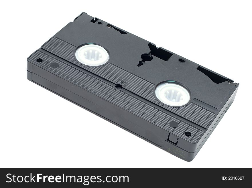 An obsolete black video tape isolated on a white background. An obsolete black video tape isolated on a white background