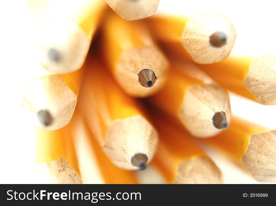 Yellow pencils against a white background