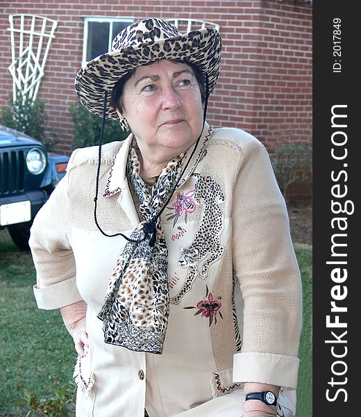 A senior citizen lady in the countryside all dressed up. A senior citizen lady in the countryside all dressed up.