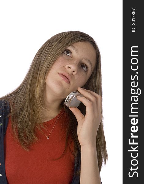 Teenager female looking up while listening on the cell phone. Teenager female looking up while listening on the cell phone