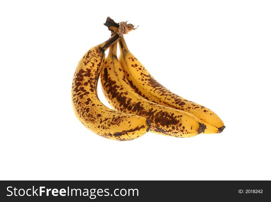 A trio of three bananas, very ripe, almost spoiled. A trio of three bananas, very ripe, almost spoiled