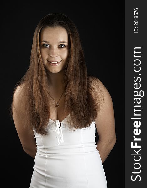 Girl in white dress on black background. Girl in white dress on black background