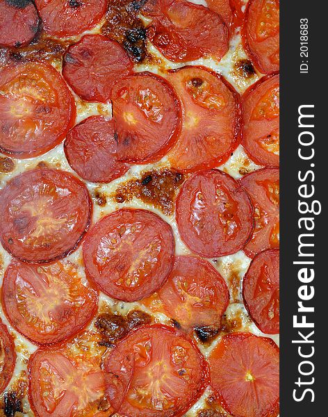 Close up of fresh tomatoes and cheese pizza topping. Close up of fresh tomatoes and cheese pizza topping.