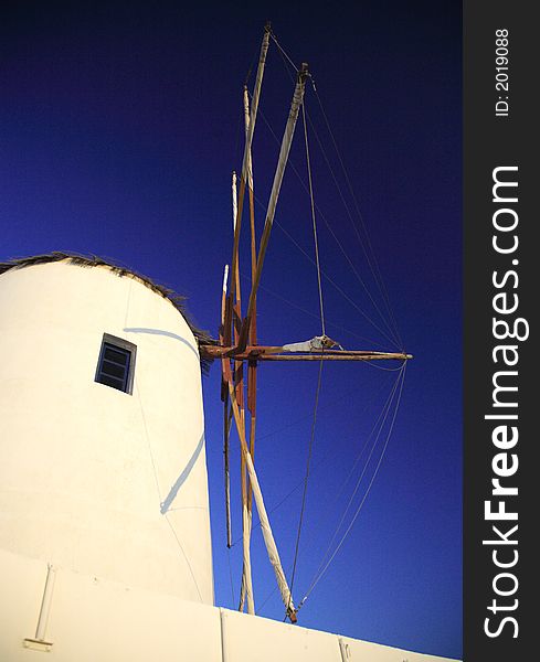 Santorini windmill against a blue sky Greece