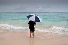 Tanned Man Stand With Umbrella In Blue Sea Royalty Free Stock Photos Tanned Man Stand With Umbrella In Blue Sea Royalty Free Stock Photos