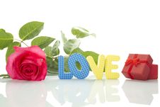 Red Rose, Gift Box And The Text LOVE Stock Images Red Rose, Gift Box And The Text LOVE Stock Images