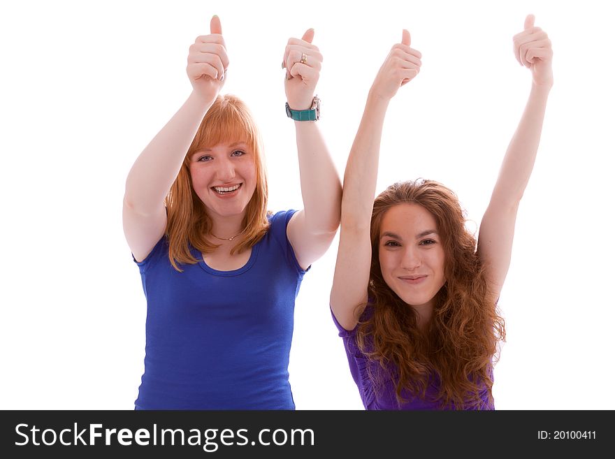 Two young girls with their thumbs up. Two young girls with their thumbs up