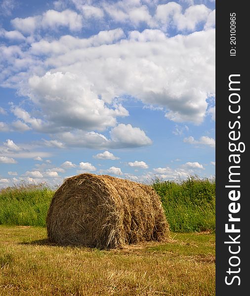The stack from straw costs on a background of the sky