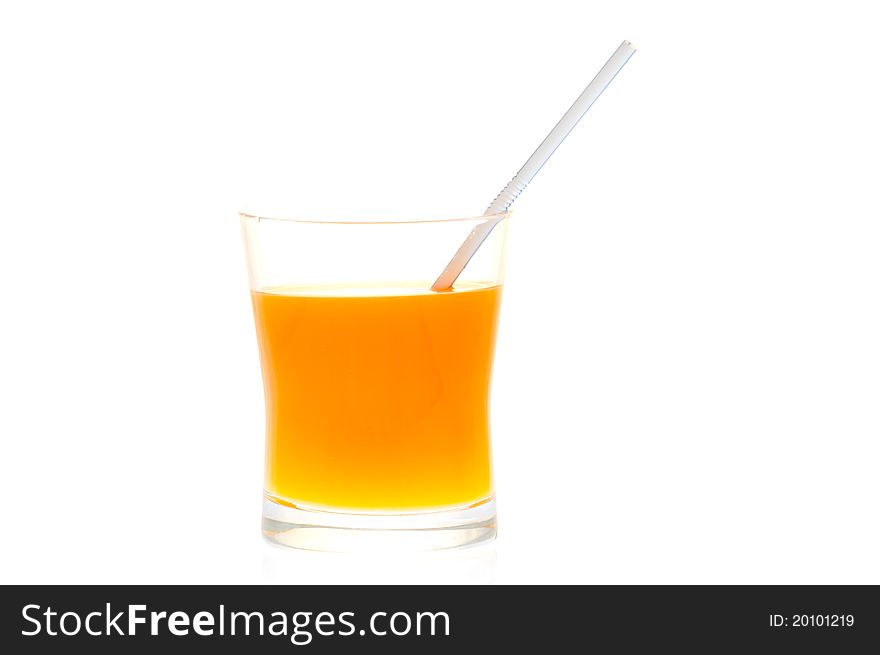 A glass of orange juice with a straw