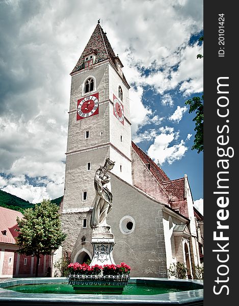 Church of Spitz in Lower Austrie with dramatic Cloudscape