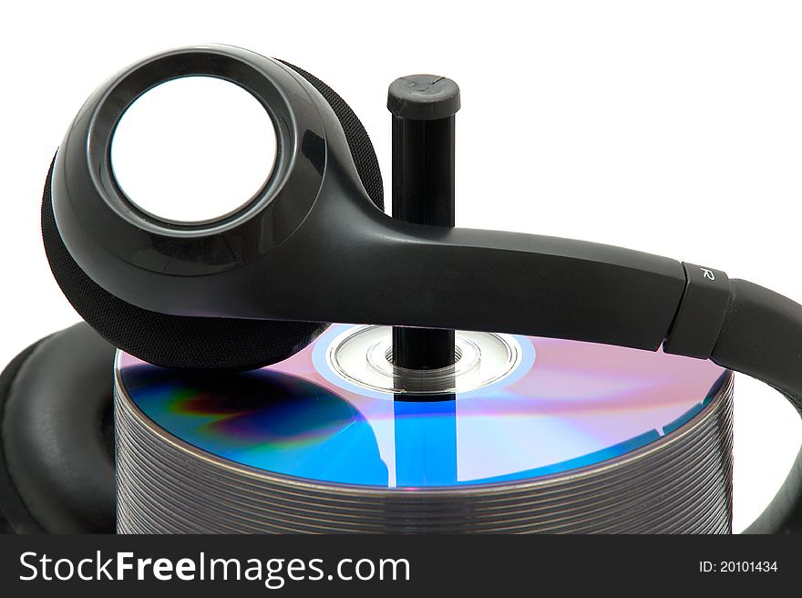 A stack of dvd with headphones. A stack of dvd with headphones