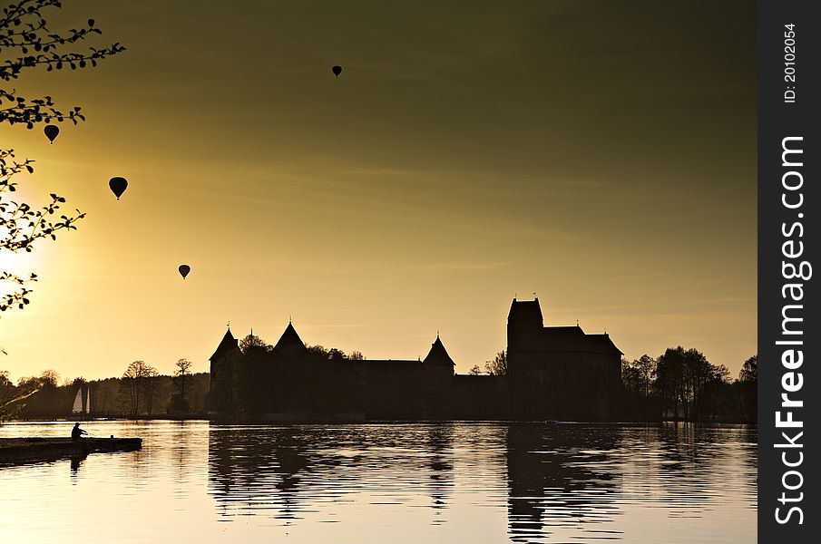 Air balloon over the lake in night.