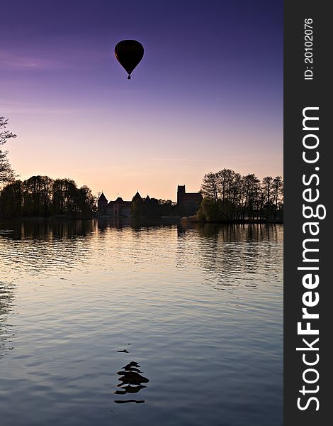 Air Balloon Over The Lake In Night.