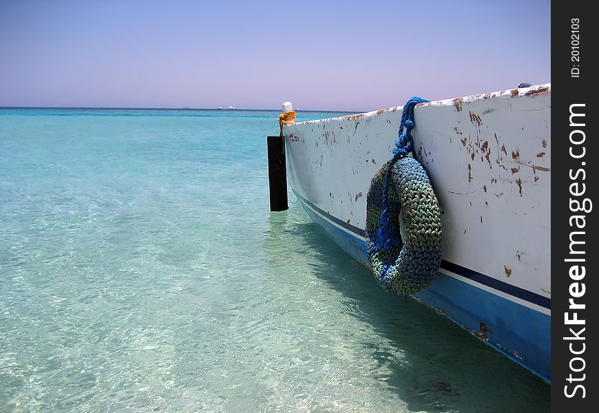 Old fishing boat docked on the coast. Old fishing boat docked on the coast